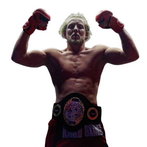 Joe Brooks posing with championship belt after winning a professional kickboxing title